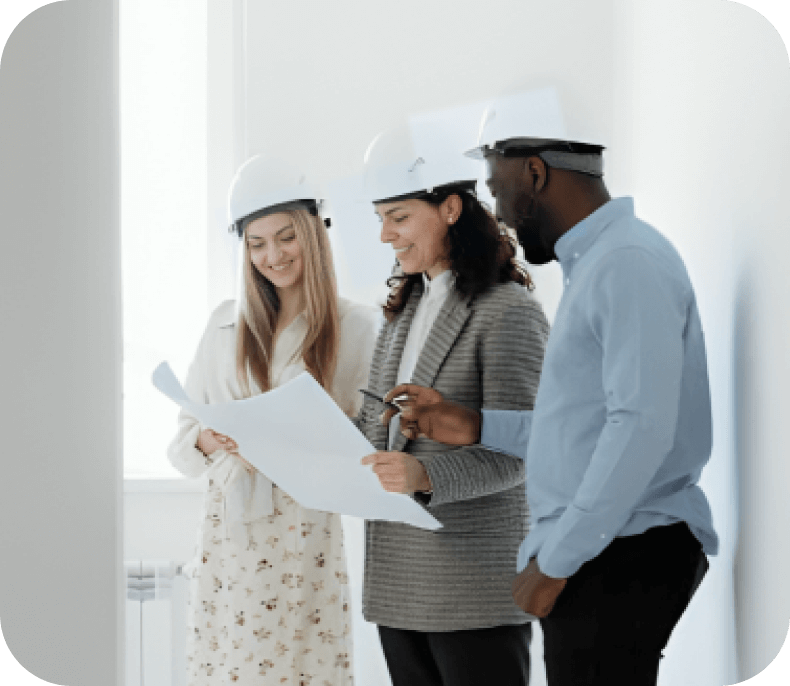 Architects reviewing blueprints together.