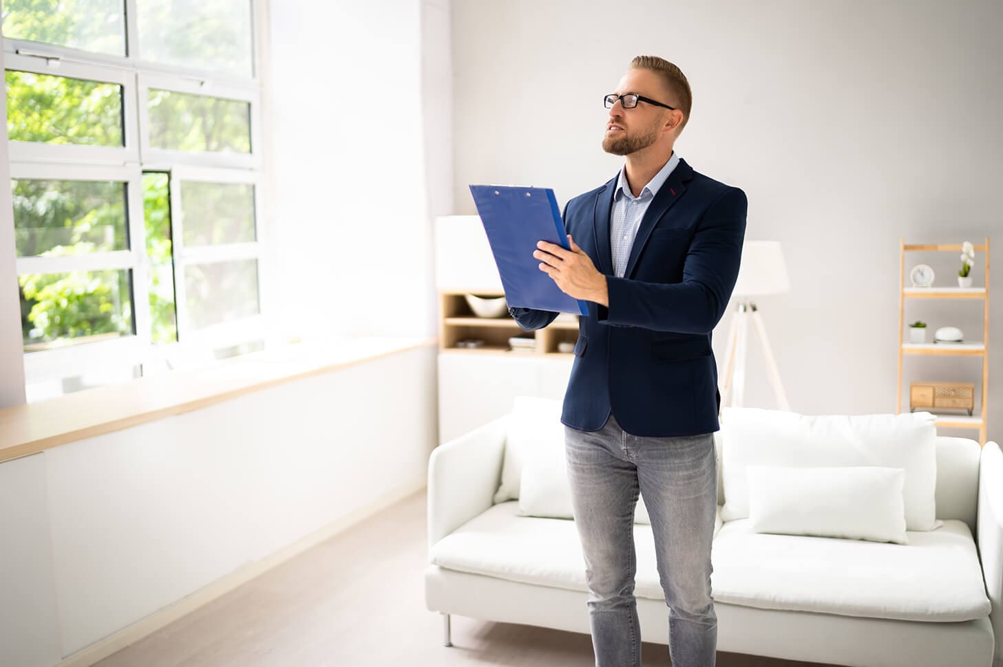 Man in suit reviewing property details.